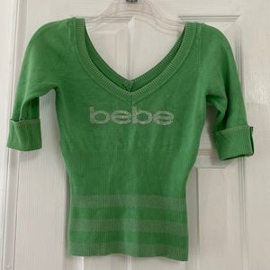 Bebe light green double V-neck short sleeve sweater. Size XS/S